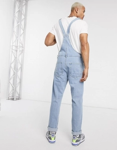 Detailed back view of men's light blue wash denim overalls with straight cut and cuffed hems