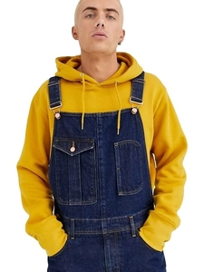 Classic men's dark blue denim overalls paired with a bright yellow drawstring hoodie