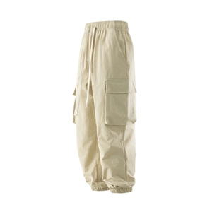 Detailed view of cargo jogger pants featuring multi-pockets and drawstring elastic waist