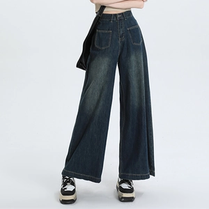 Donkerblauwe jeans met wijde pijpen, hoge taille, opgestikte zakken en vintage wassing