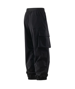 Detail view of black multi-pocket cargo pants featuring elastic drawstring waist and cuffs