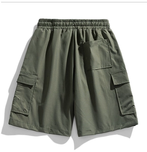 Rear view detail of olive green cargo shorts featuring elastic waist and utility square pocket