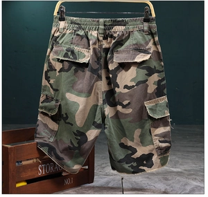Detail view of cargo camo shorts showing back flap pockets and elastic waistband