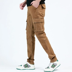 Detail shot of khaki slim-fit cargo pants with large flap side pockets and durable cotton fabric