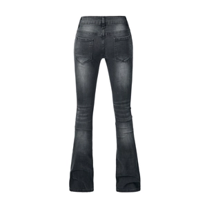 Detail of high waist flare jeans with vintage faded wash and back pocket design