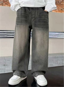 Men's loose fit dark grey washed denim jeans with distressed frayed hems on street
