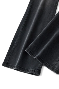 Detailed close-up showing high-density denim fabric and double-stitched hem on flared jeans