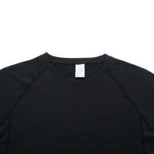 Close-up of raglan sleeve and neck detail on 88% polyester 12% spandex compression shirt