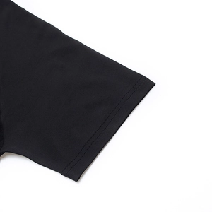 Detail of double-needle stitching on the sleeve cuff of a black athletic gym t-shirt