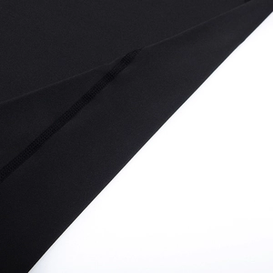 Detail of high-quality flatlock seam on black compression gym shirt for men