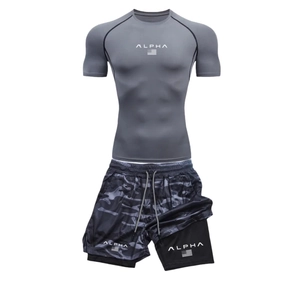 Detail of men's quick-dry gym set with grey compression shirt and camo shorts
