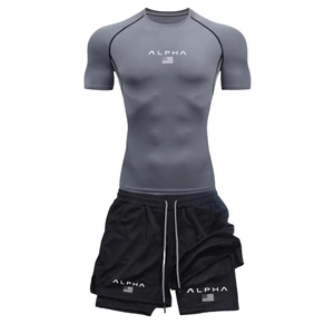 Detail view of men's gray compression shirt and black layered athletic shorts on invisible model