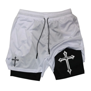 Detail view of double-layer mesh sports shorts with gothic cross prints and drawstring waist