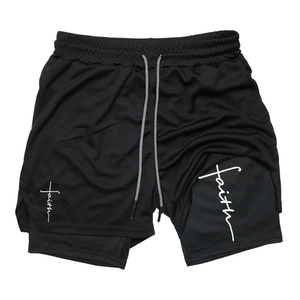 Detail of black double-layer athletic shorts with faith print and mesh fabric