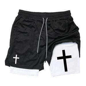Detail of double-layer sports shorts with breathable mesh and cross pattern print