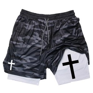 Detail of men's double-layer sports shorts with camo pattern and drawstring waistband