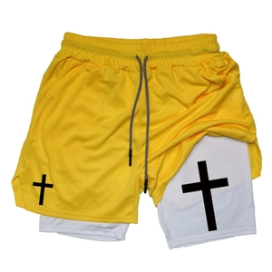 Detail of men's double-layer gym shorts featuring yellow mesh and white compression liner