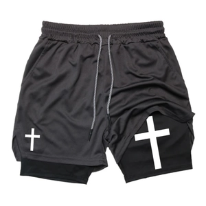Close-up of men's double-layer sports shorts with breathable mesh and cross print