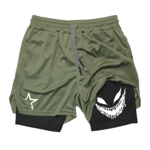 Detail of olive green mesh sports shorts with inner layer and white star print