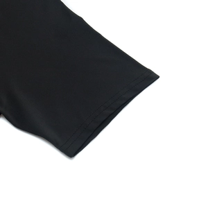 Close-up of black sports T-shirt cuff with durable double-needle stitching detail