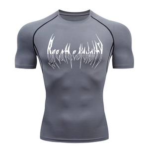 Close-up of dark grey compression t-shirt featuring white gothic chest print and stitching