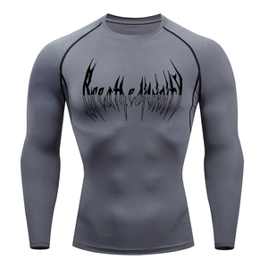 Detail of grey men's compression long sleeve shirt showing Breathe print and raglan seams