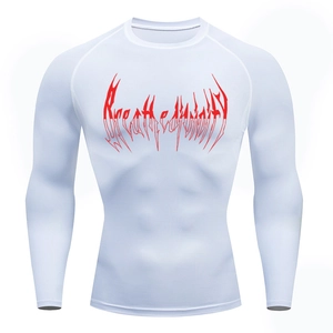 Close-up of white compression shirt showing breathable fabric and red chest print