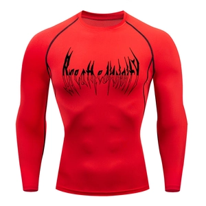 Detail of red compression shirt with black flatlock stitching and gothic chest print