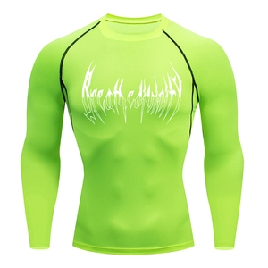 Detail of neon green compression shirt showing black flatlock seams and athletic logo