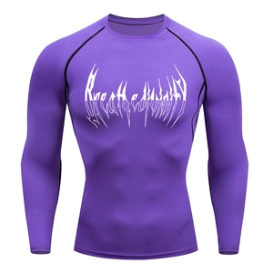 Close-up of purple long-sleeve compression shirt with white gothic chest print detail