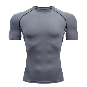 Men's grey compression workout t-shirt with black raglan sleeves and athletic seams