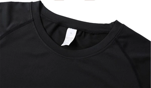 Detail of crew neck collar with size L tag on black polyester spandex sports t-shirt