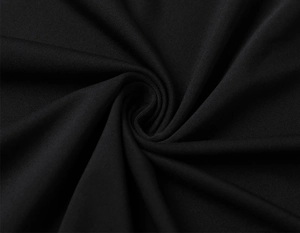 Close-up of black breathable quick-dry fabric showing high-density knit texture for sports