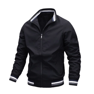 Detail of black casual jacket featuring blue and white striped ribbed cuffs and collar