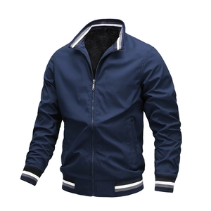 Detail of navy blue bomber jacket with striped rib-knit collar and warm fleece lining