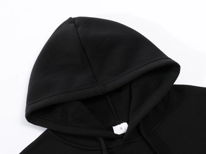 Close-up of the black hoodie neckline with adjustable drawstring and size S tag