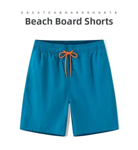 Close-up of peacock blue quick-dry swim trunks featuring bright orange adjustable drawstrings