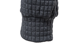 Detailed macro view of dark grey hoodie fabric with embossed square lattice texture