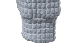 Detailed close-up of gray waffle knit fabric texture on sweatshirt cuff and hem