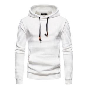 Detailed close-up of white waffle texture fabric and black drawstring on men's hoodie