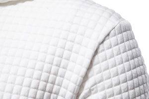 Detailed macro view of the white quilted square jacquard pattern on a casual hoodie