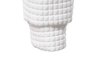 Close-up of white waffle texture knit fabric on a stylish men's hooded sweatshirt