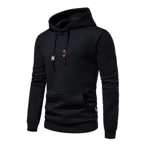 Men's stylish black waffle knit pullover hoodie with drawstring and kangaroo pocket