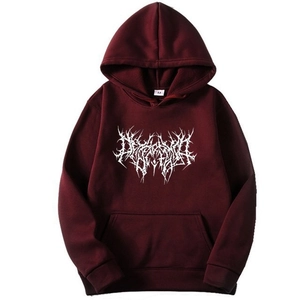 Close-up of gothic white lettering print and kangaroo pocket on maroon hoodie