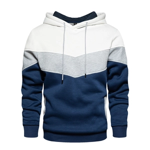 Detail of color-block hoodie with V-shaped design in white, grey and navy blue