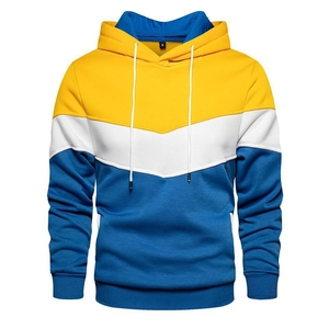 Detail view of contrast color stitching and kangaroo pocket on yellow white and blue hoodie