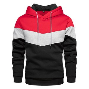Detail view of the red, grey, and black color-block hoodie showing the neckline and S size label