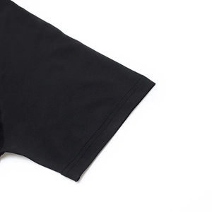 Detailed close-up of double-stitched sleeve cuff on black MMA compression shirt
