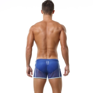 Detailed view of blue breathable mesh fabric and white piping on men's lounge shorts