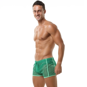 Detail of green mesh breathable men's shorts with elastic waistband and drawstring